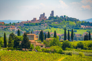Medieval San Gimignano hill town with skyline of medieval towers, including the stone Torre Grossa. Province of Siena, Tuscany, Italy.