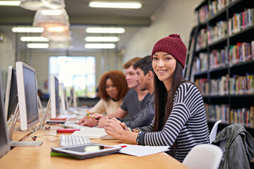 Study group, students and portrait of girl in library for education, assignment or academic research. Campus, college or university for learning, female scholar or friends for essay project by pc