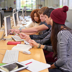 Study group, students and computer in library for education, assignment and academic research. Campus, college or university for learning, scholar people and discussion for team project by desktop