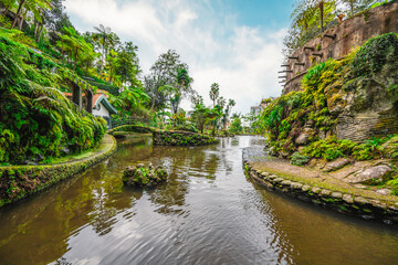 Monte Palace, Tropical Garden with Waterfalls, Lakes and traditional buildings above the city of...
