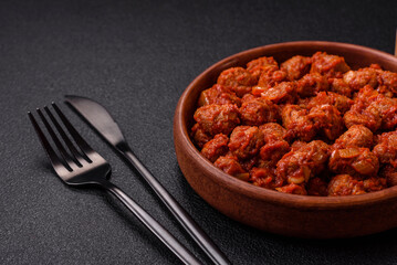 Delicious soy meat with tomato sauce, salt and spices