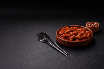 Delicious soy meat with tomato sauce, salt and spices