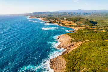 Obraz premium Aerial view of voidokilia beach, lagoon with beaches in mediterranean, Ionian Sea, Pylos town , Greece. Navarino Castle on hill.