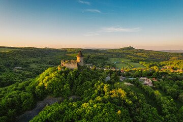 Ruins of a medieval castle Somoska or Somoskoi var on borders of southern Slovakia and Hungary at sunrise time.  .Salgo Castle or Salgo vara in background