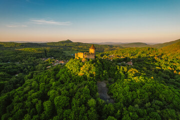 Ruins of a medieval castle Somoska or Somoskoi var on borders of southern Slovakia and Hungary at sunrise time.  .Salgo Castle or Salgo vara in background