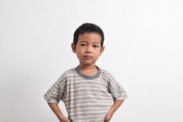 Image of Asian child posing angry face on white background. portrait of an Asian boy