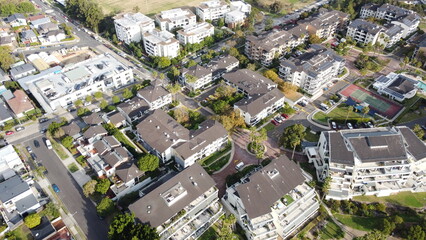 Aerial drone view of waterfront property and houses