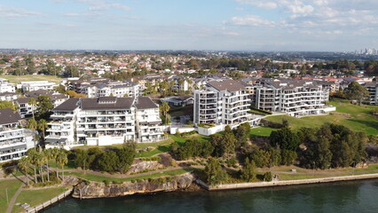 Aerial drone view of waterfront property and houses