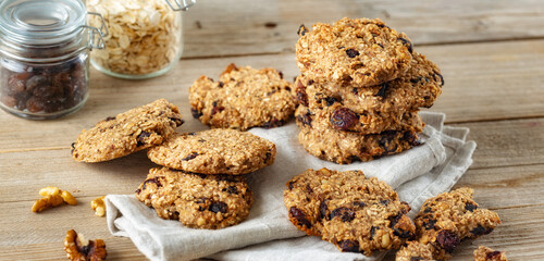 Oat cookies with cranberry and raisins on a wooden table