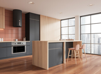 Elegant home kitchen interior with bar island and cabinet, panoramic window