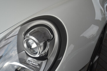 Car headlight close-up. Luxury vehicle detail of headlight.