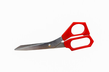 Red Scissors used for cutting paper and various thin materials. Object is isolated on white background without shadows.