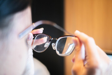 Cleaning eyeglasses close-up