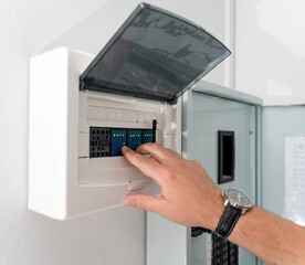 A technician works with a demo kit of the smart home system