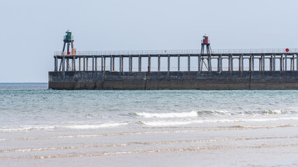The Whitby Piers and Lighthouses, seen from the beach