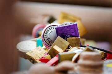 COLORFUL PADLOCKS TIED ON RAINY DAY