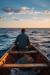 Fototapeta premium Fisherman at sea in wooden boat