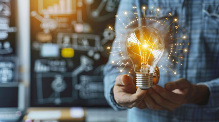 Man Holding Glowing Lightbulb Symbolizing Innovation and Ideas
