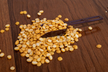 Organic bengal gram (cicer arietinum) in spoon on wooden background