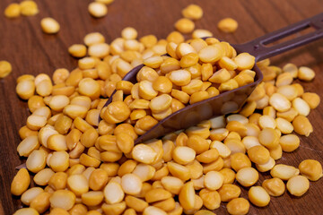 Organic bengal gram (cicer arietinum) in spoon on wooden background