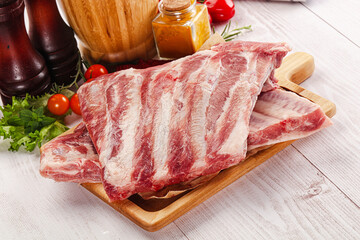 Raw pork ribs over board