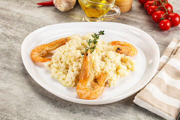 Italian risotto with prawn served thyme