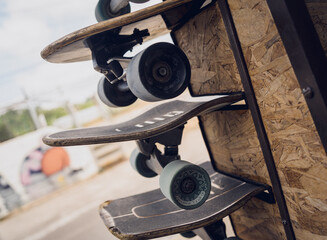 A stack of skateboards on a special outdoor stand