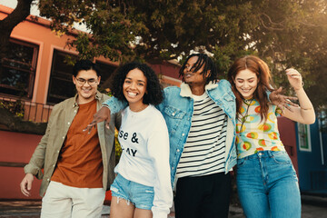 Group of happy friends bonding while enjoying an outdoor lifestyle together