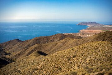 View from a viewpoint of the Puntas de Calnegre regional park in the Region of Murcia, Spain with its coves and arid landscape