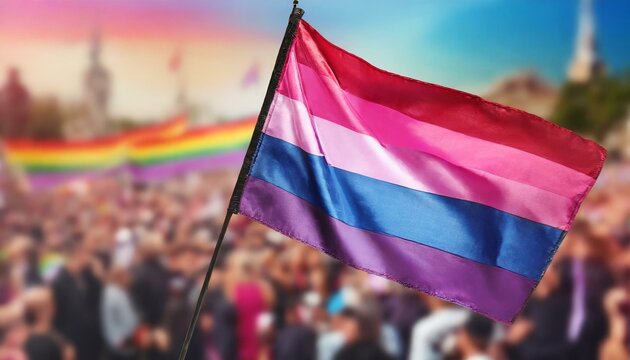 bisexual flag on the background of the pride parade, lgbt pride month, fight against homophobia, tolerance, rally of many people