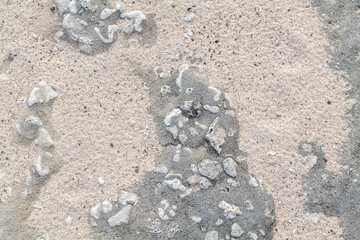 Sand with Beachrock.  Beachrock is a friable to well-cemented sedimentary rock that consists of a variable mixture of gravel-, sand-, and silt-sized sediment. fragments of coral and shells . Geology 