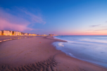 Ostend, Belgium. Panoramic view of the sea coast during sunset. Real estate on the coast. Long exposure. General view of the city.
