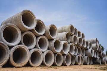 A stack of concrete ring pipes piled and creating a symmetrical arrangement