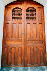 Details of a Spanish wooden door. Spanish style medieval wooden door