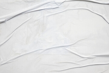 white crumpled and creased glued wrinkled paper poster texture background