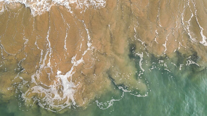 Aerial view of waves crashing on the sandy beach. Sao Tome and Principe, Africa