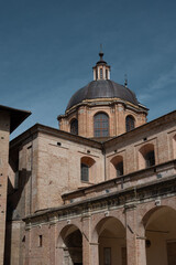 Ancient structure with a high tower and domed roof in the province of Pesaro and Urbino