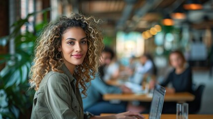Portrait of a beautiful Middle Eastern manager, a stylish young woman with curly hair.