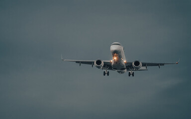 Airplane taking off in front of the dark clouds