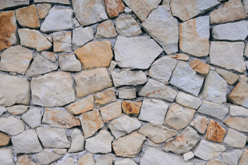 Various sized stones form a wall
