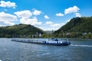 Obraz premium River boat sailing with hills in the backdrop, Rhine, Germany