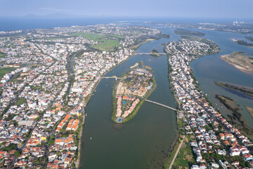 Aerial view of Hoi An town and Thu Bon river on sunny day. Vietnam.