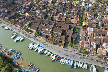 Aerial view of central part of Hoi An town and Thu Bon river on sunny day. Vietnam.