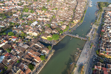 Aerial view of Hoi An ancient Town and Thu Bon river on sunny day. Vietnam.