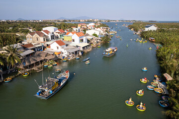 Drone view of Coconut basket boats on Thu Bon river on sunny day. Hoi An, Vietnam.