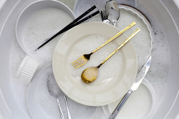 Dirty dishes, cleaning cooking utensils concept