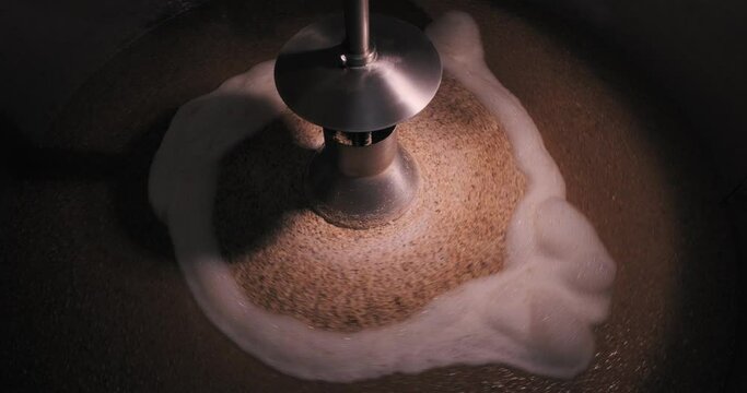 View into the mash tank during the mashing process at a brewery