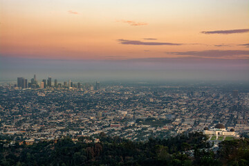 Aerial view of from downtown Los Angeles to Griffith Park at sunset