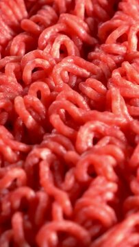 Ground  red meat beef minced butchery close up vertical video 