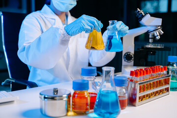 Female biotechnologist testing new chemical substances in a laboratory..